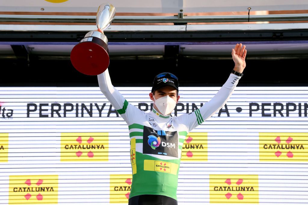 PERPIGNAN FRANCE MARCH 22 Jonas Iversby Hvideberg of Norway and Team DSM celebrates winning the green leader jersey on the podium ceremony after the 101st Volta Ciclista a Catalunya 2022 Stage 2 a 2024km stage from LEscala to Perpignan VoltaCatalunya101 WorldTour on March 22 2022 in Perpignan France Photo by David RamosGetty Images
