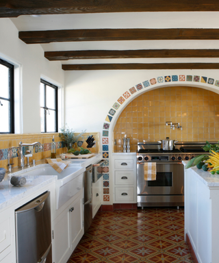 A tiled range hood with a yellow background