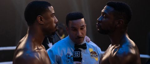 Michael B. Jordan and Jonathan Majors touch gloves in Creed III