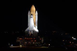 The space shuttle Atlantis rolls out to Launch Pad 39A in preparation for its final launch in July.
