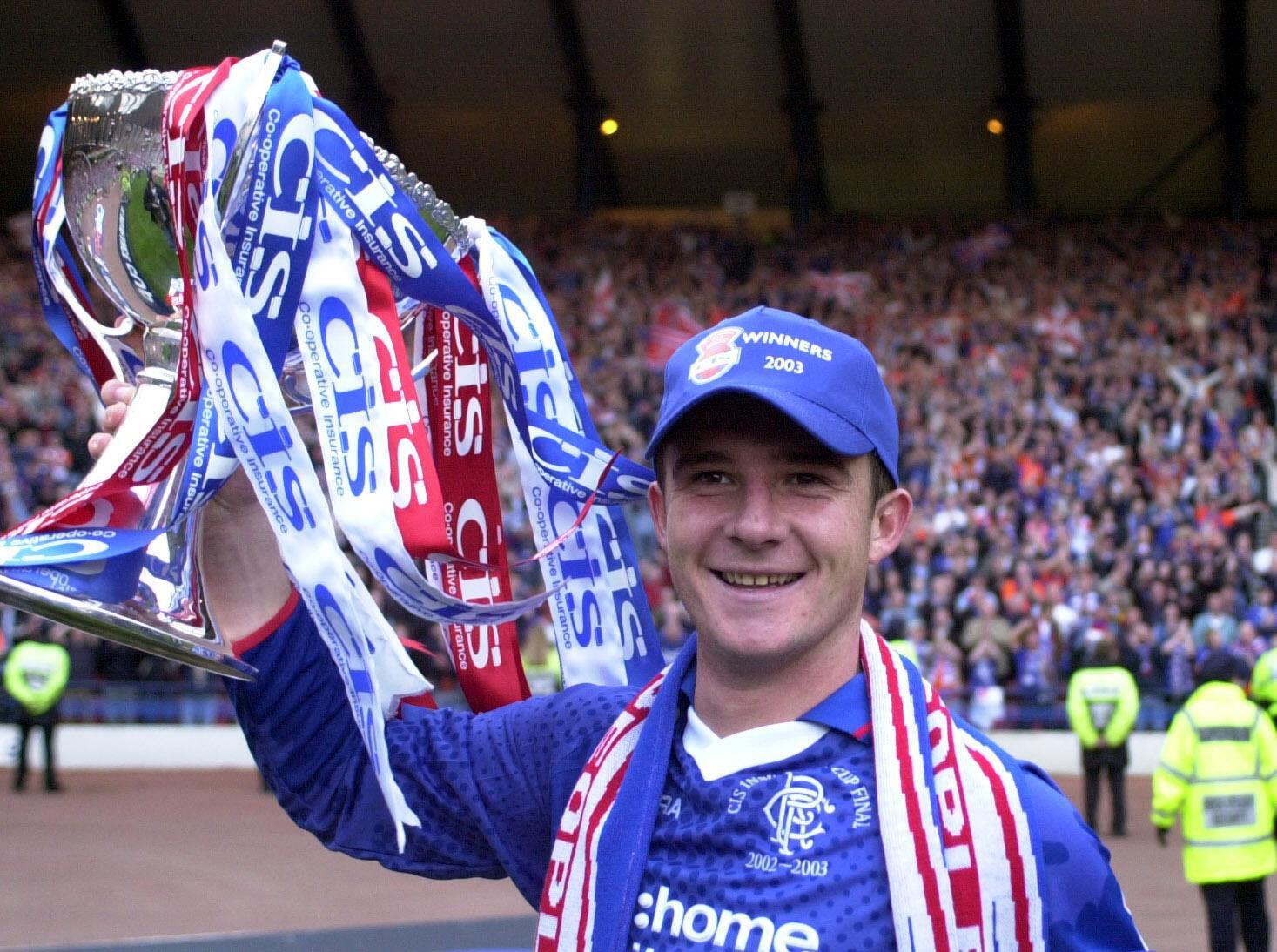 Barry Ferguson of Rangers celebrates with the Scottish League Cup, 2003