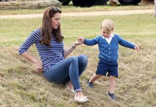 Catherine Duchess of Cambridge and Prince George attend the Gigaset Charity Polo Match