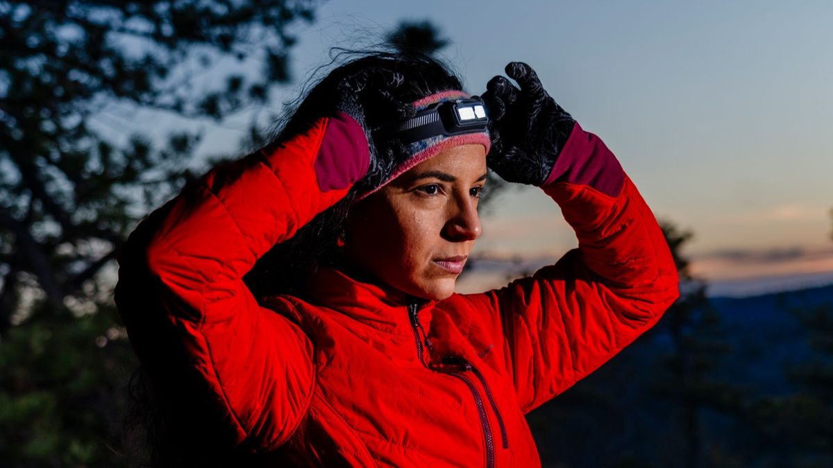 A woman wearing the BioLite Dash 450 headlamp