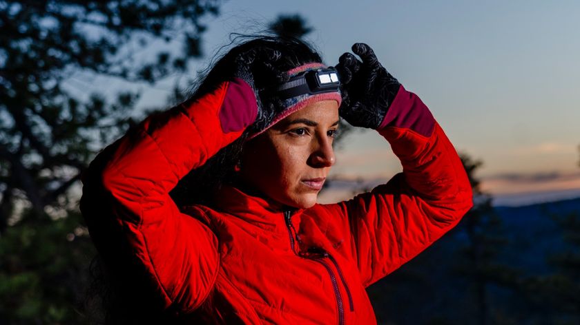 A woman wearing the BioLite Dash 450 headlamp