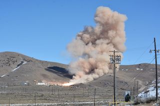 The plume from the static test of Northrop Grumman's new OmegA Castor 300 second stage billows out against the snow-capped mountains of Promontory, Utah on Thursday, Feb. 27, 2020.