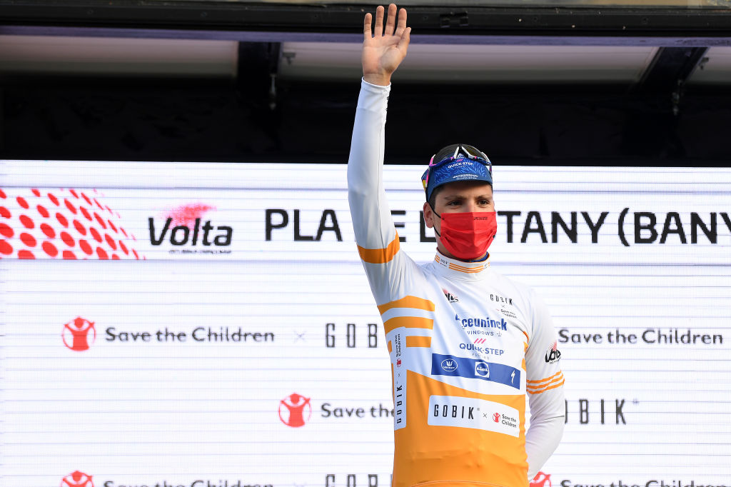 PLA DE LESTANY BANYOLES SPAIN MARCH 23 Podium Joo Almeida of Portugal and Team Deceuninck QuickStep Yellow Best Young Rider Jersey Celebration during the 100th Volta Ciclista a Catalunya 2021 Stage 2 a 185km Individual Time Trial stage from Pla de LEstany Banyoles to Pla de LEstany Banyoles 145m ITT Trophy Mask Covid Safety Measures VoltaCatalunya100 on March 23 2021 in Pla de LEstany Banyoles Spain Photo by David RamosGetty Images
