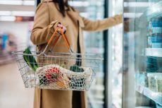 Close-up shot of woman carrying shopping basket