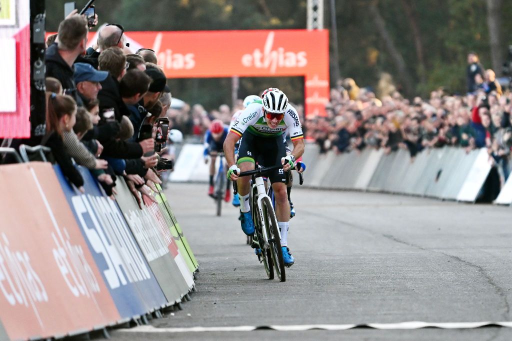 BERGEN NETHERLANDS NOVEMBER 13 Laurens Sweeck of Belgium and Team CrelanFristads sprints at finish line as race winner during the 1st UCI Cyclocross World Cup Beekse Bergen 2022 Mens Elite CXWorldCup BeekseBergen Cyclocross on November 13 2022 in Bergen Netherlands Photo by Luc ClaessenGetty Images