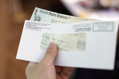 U.S. Treasury bills peeking out of an envelope