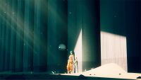 Motorslice review; a woman leans against a concrete pillar