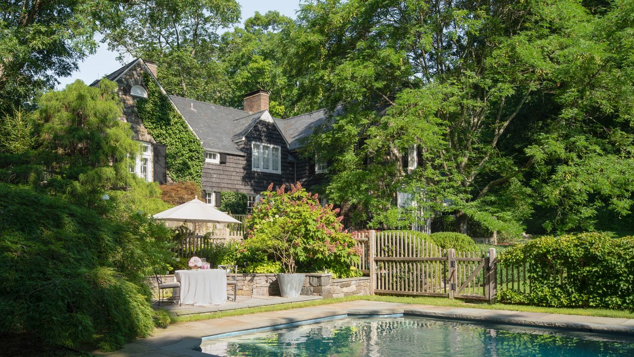 exterior of stone cottage with swimming pool 