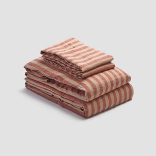 Sandstone Red Pembroke Stripe Linen Bedding Bundle against a gray background.