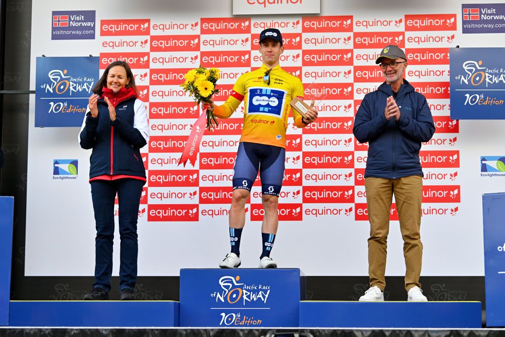 ALTA NORWAY AUGUST 17 Alberto Dainese of Italy and Team DSMFirmenich celebrates at podium as Yellow leader jersey winner during the 10th Arctic Race of Norway Stage 1 a 171km stage from Kautokeino to Alta UCIWT on August 17 2023 in Alta Norway Photo by Luc ClaessenGetty Images