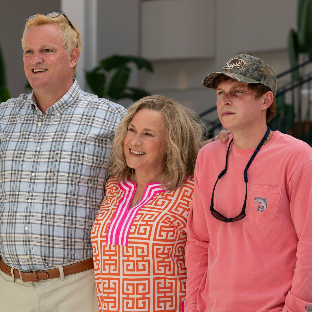 a family poses for a photo smiling in a still from murdaugh death in the family