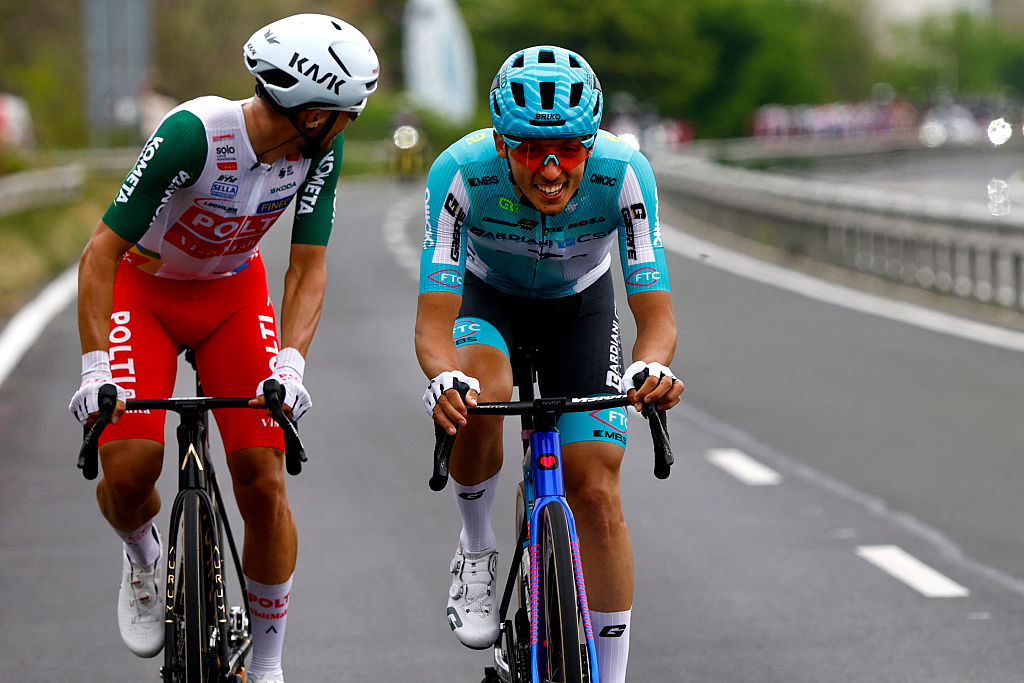 Tarozzi looking back as Sevilla rides beside him