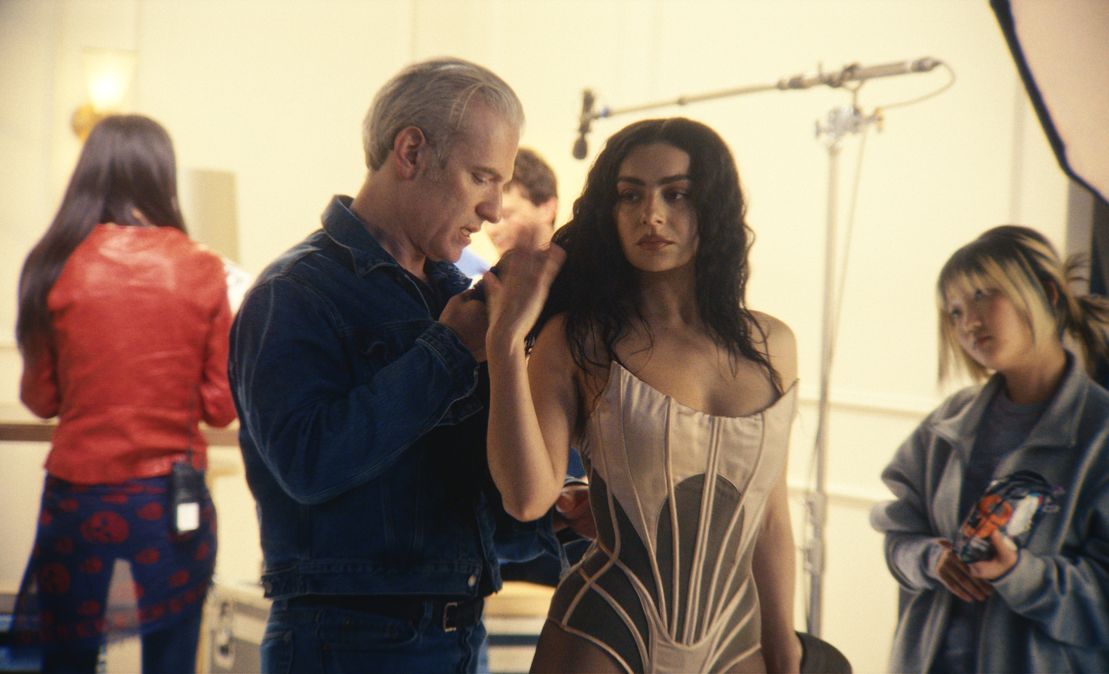 charli xcx gets fitted for a tour costume in a dressing room in a still from the a24 movie the moment