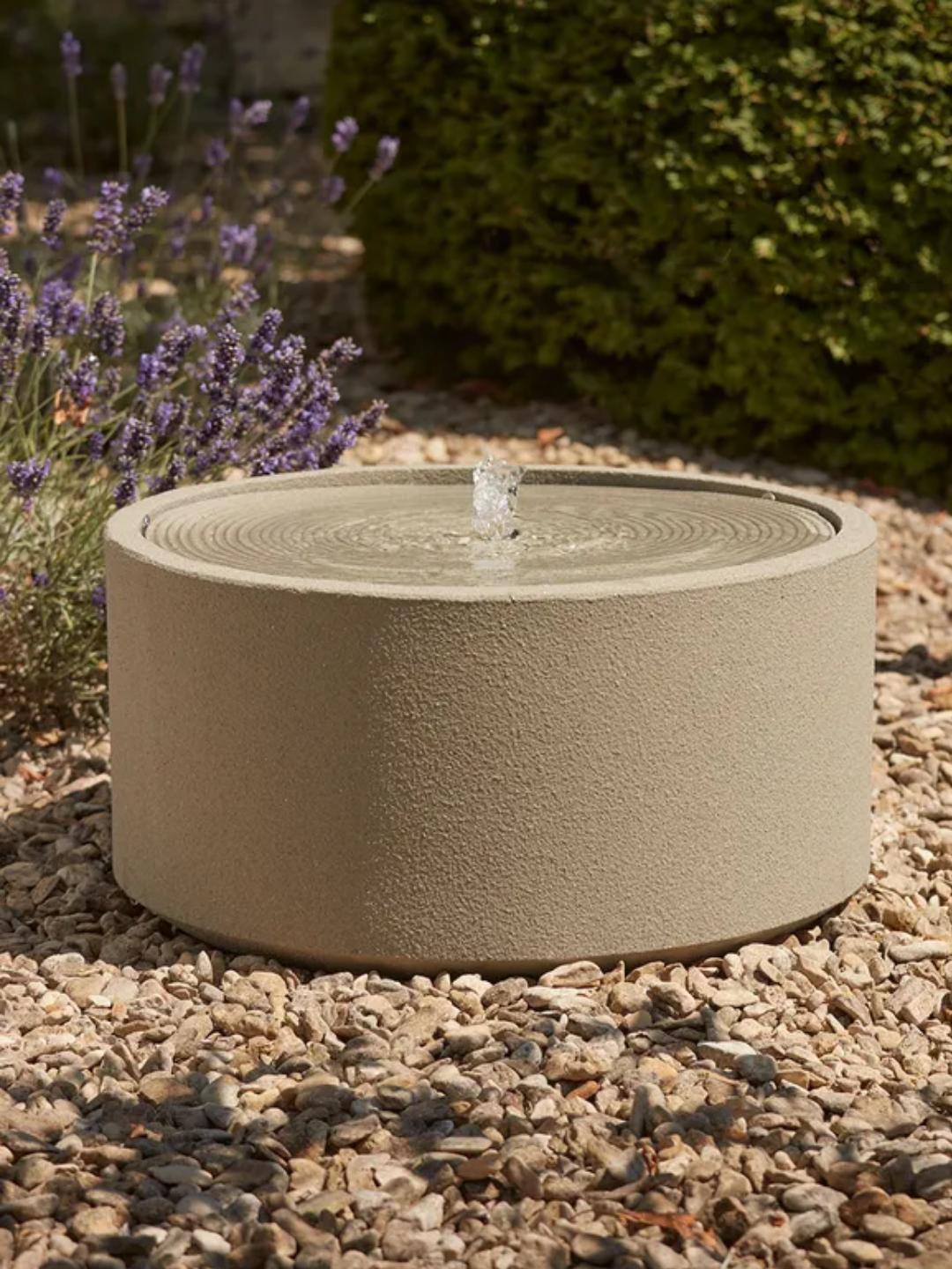 A textured round outdoor water feature