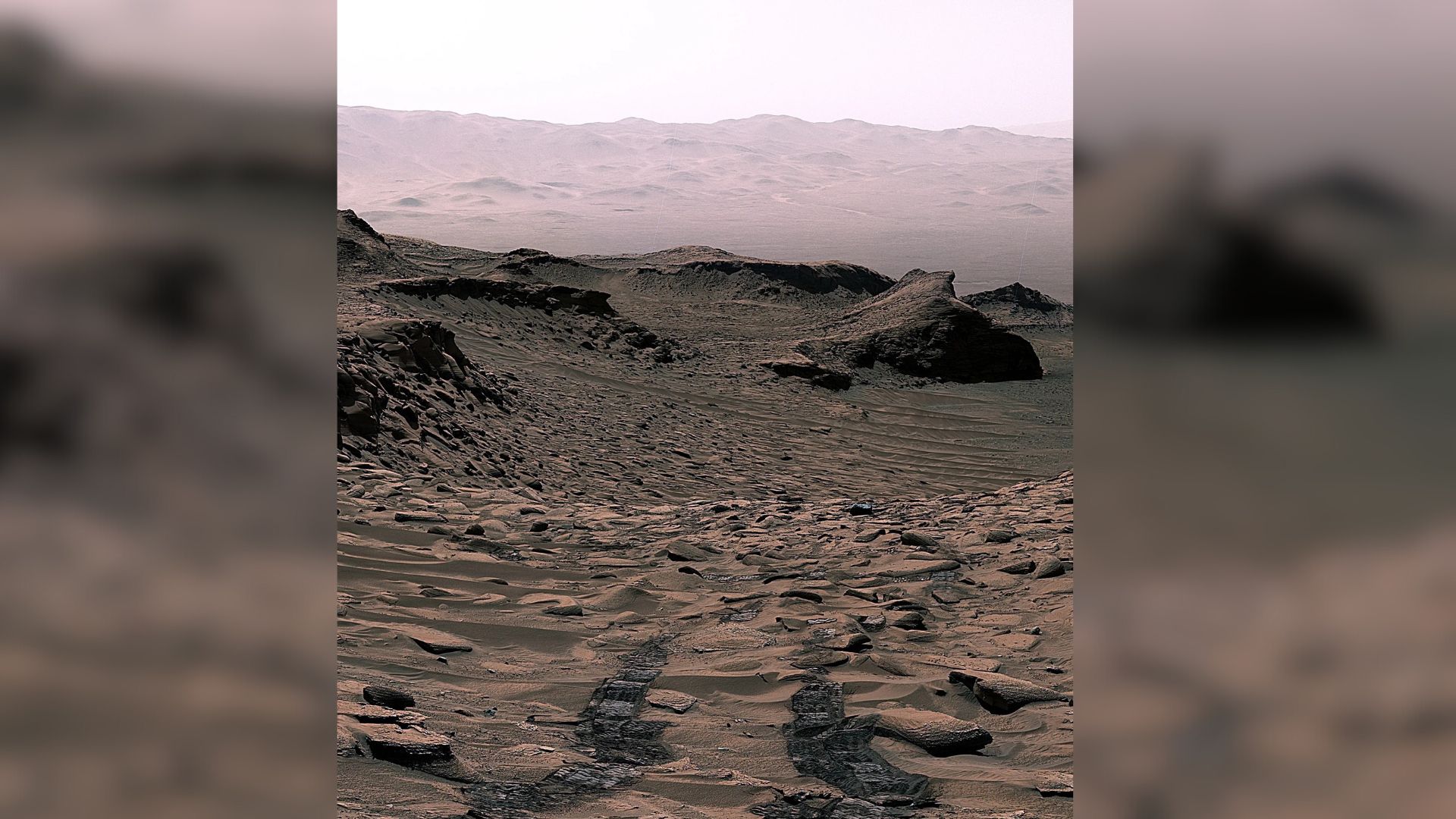A series of valleys and ridges on the surface of Mars