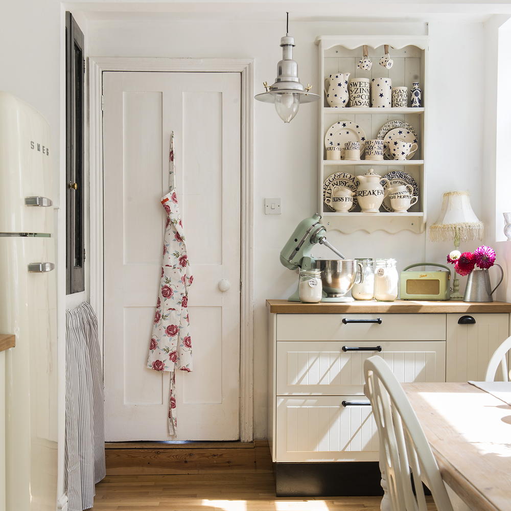 kitchen with white wall dining table and chair