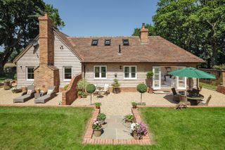 gravel patio with brick retaining wall edging