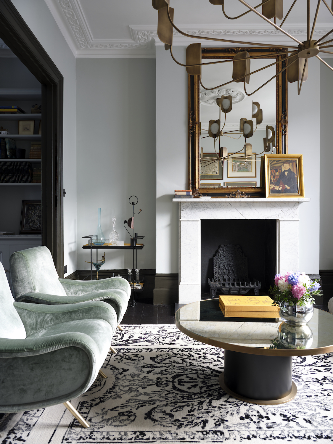 large living room with pale green chairs