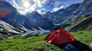how to choose a tent: wild camp by mountain pool