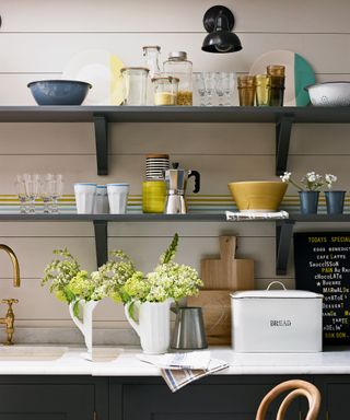 kitchen storage with crockery and jars on display