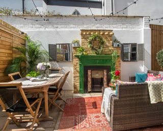 eclectic courtyard with fireplace and colorful accessories