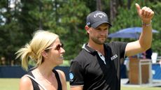 Thomas Detry gives a thumbs up to the fans while holding his wife's hand at the 2024 US Open