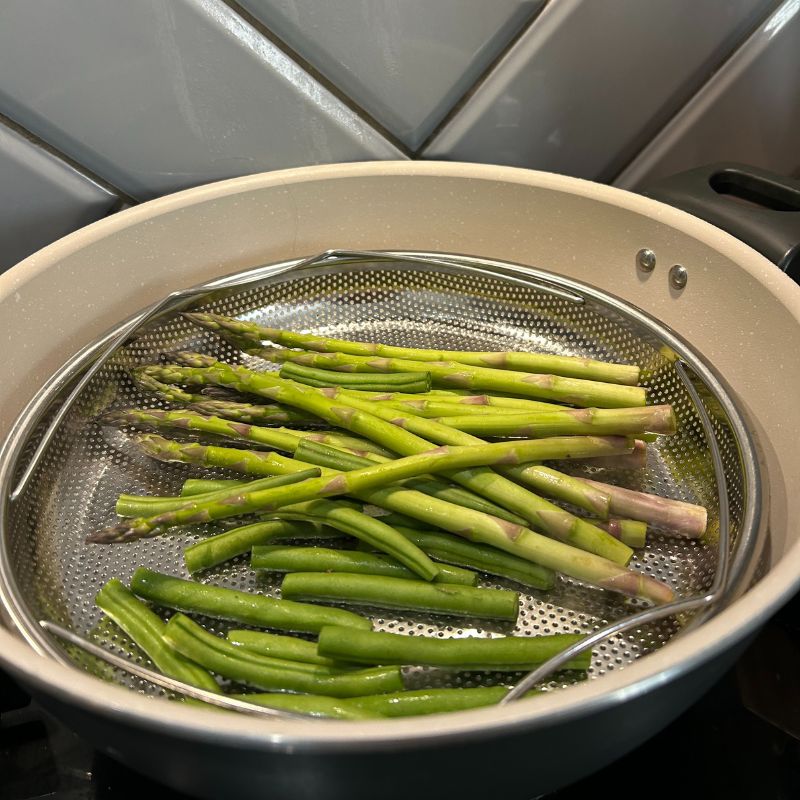 M&amp;amp;S All In One 28cm Saucepan cooking asparagus and green beans in steamer basket