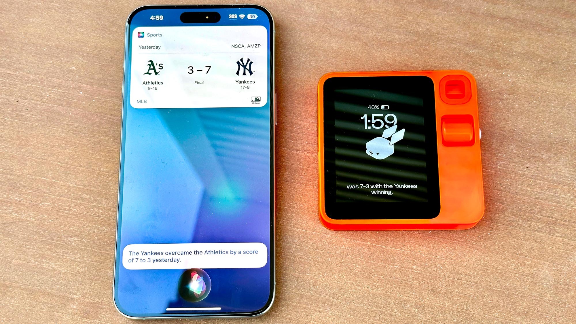 Rabbit R1 vs. Siri on an iPhone baseball score