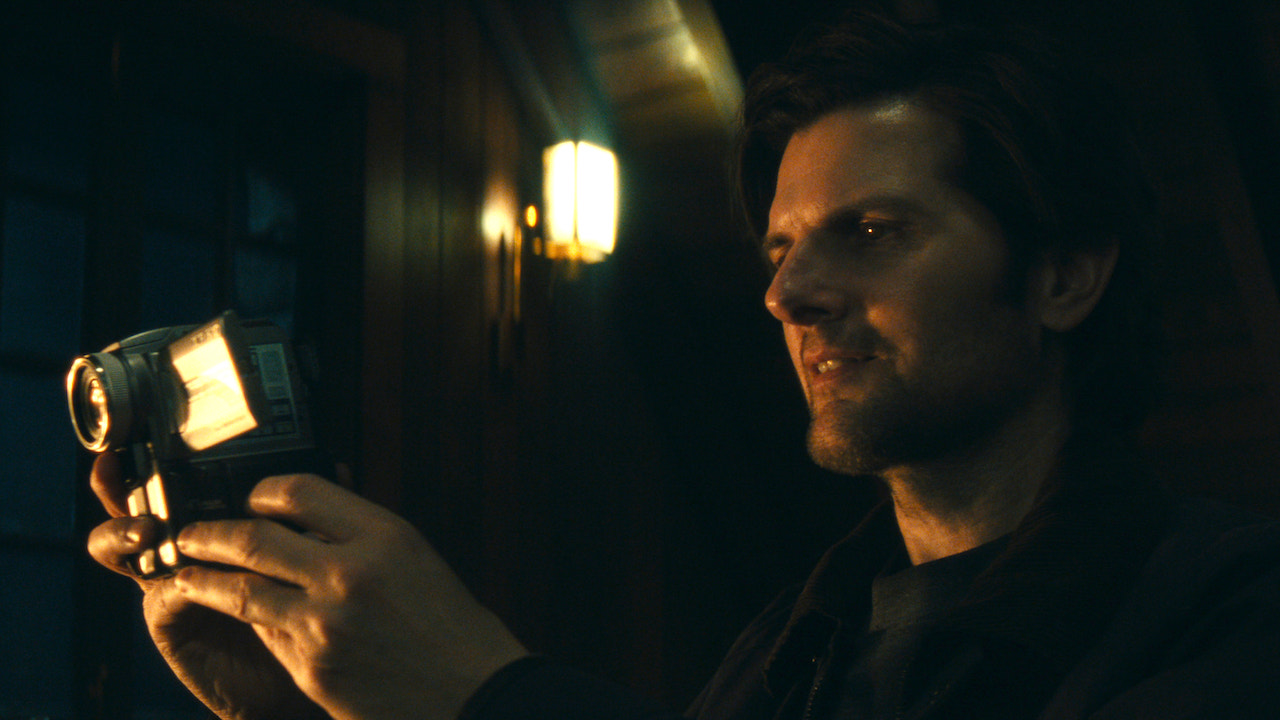 Adam Scott as Mark talking into a camcorder in Severance Season 2 finale