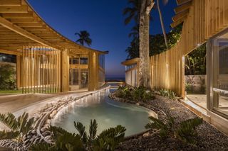 beachfront house al suave in el salvador showing indoor outdoor areas and swimming pools, and bamboo construction