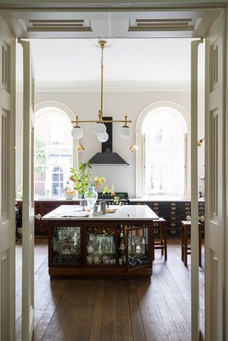 Kitchen with large island and gold globe pendant lighting