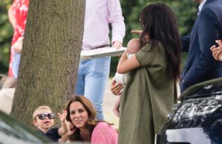 Meghan, Duchess of Sussex, Archie Harrison Mountbatten-Windsor, Catherine, Duchess of Cambridge and Prince Louis attend The King Power Royal Charity Polo Day