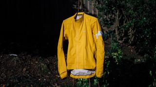 A yellow rapha core waterproof jacket