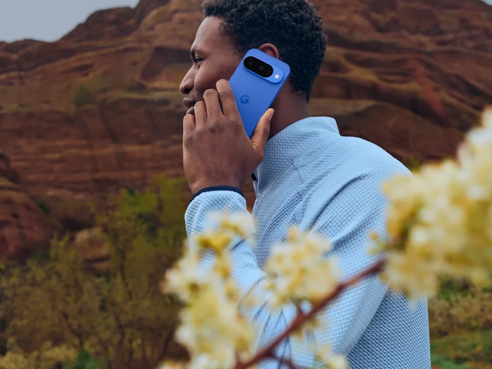 Google Pixel in Blue being held by a man