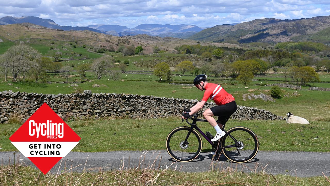 Image shows a rider cycling outside.