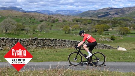 Image shows a rider cycling outside.