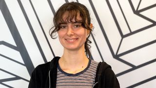 Clara Cornish Aardman animator interview; a woman stands in front of a black and white background