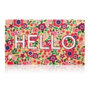 A floral-patterned welcome mat that says 'hello'