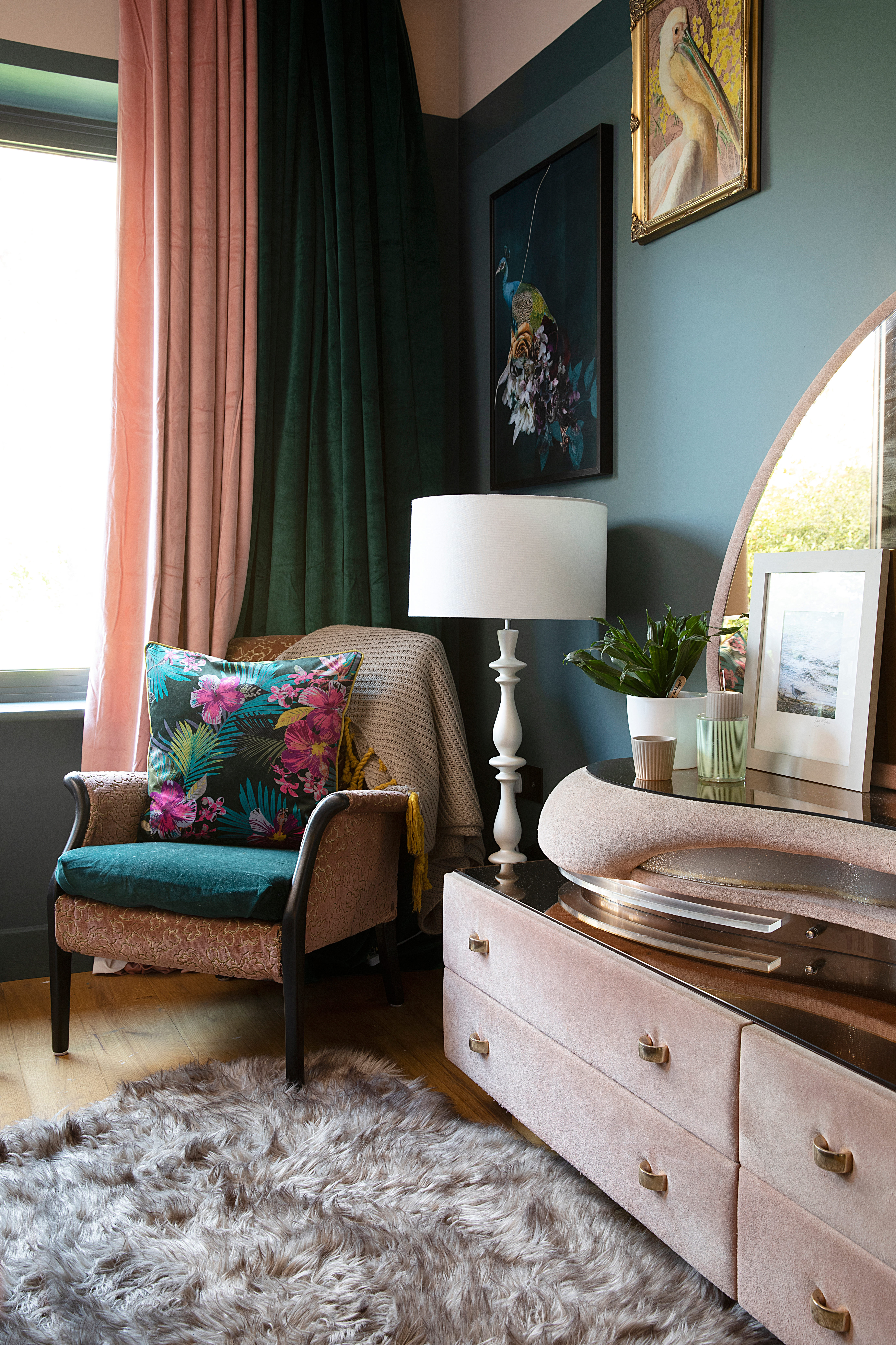 Green bedroom with pink armchair