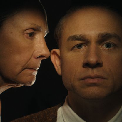 augusta gein talks in her son ed's ear in a still from monster the ed gein story