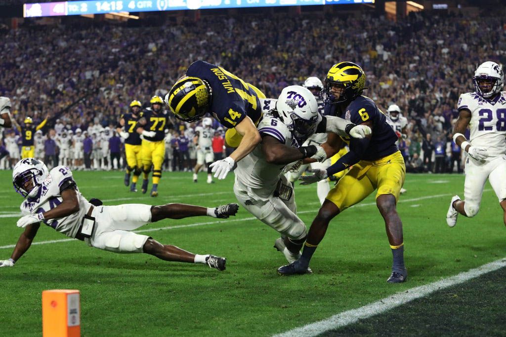 Michigan Wolverines Wide Receiver Roman Wilson (14) dives into the endzone for a touchdow during the fourth quarter of the Vrbo Fiesta Bowl College Football Playoff semifinal game between the Texas Christian Horned Frogs and the Michigan Wolverines on December 31th, 2022, at State Farm Stadium in Glendale, AZ. (Photo by Zac BonDurant/Icon Sportswire via Getty Images)