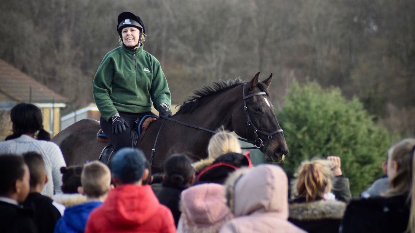 Headteacher takes assembly on her event horse to mark World Book Day