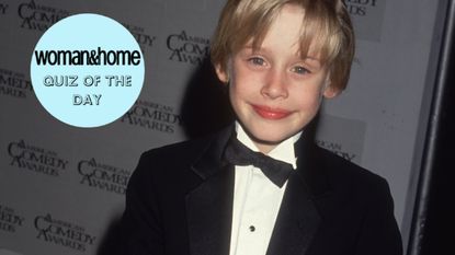  American child actor Macaulay Culkin smiles while holding an award in a tuxedo backstage at the American Comedy Awards. Culkin won Funniest Actor in a Motion Picture (Leading Role) for his work in director Chris Columbus's film, 'Home Alone.' (Photo by Darlene Hammond/Hulton Archive/Getty Images)
