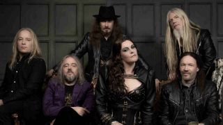 Nightwish seated on a wooden bench
