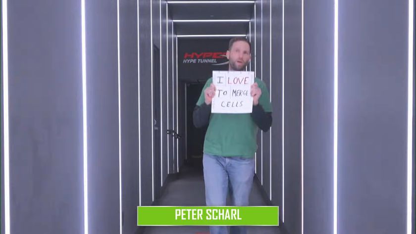 Microsoft Excel World Championship competitor Peter Scharl holding a sign saying &quot;I love to merge cells&quot;