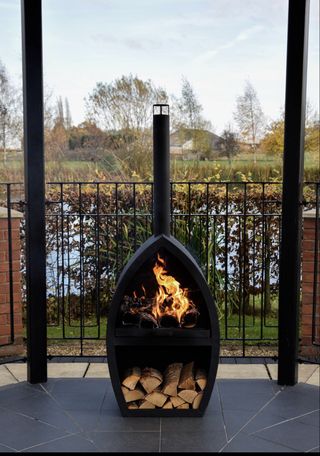 outdoor fireplace with integrated log store