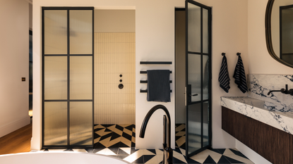 a large bathroom with a shower room and freestanding bath